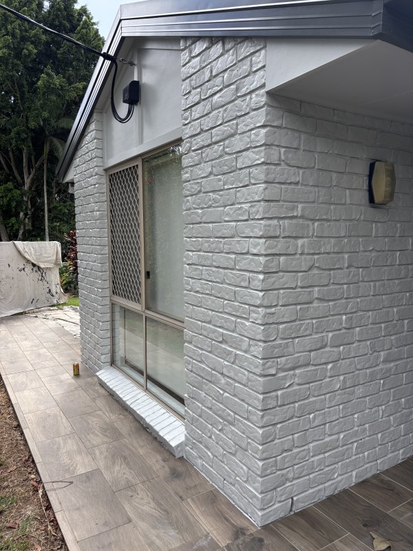 Freshly painted white brick exterior